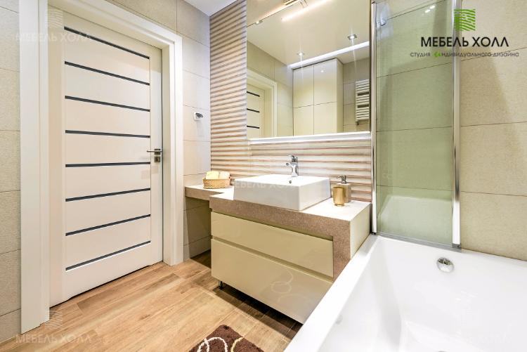 Мебель для ванной комнаты изготовлена из устойчивой к влаге лакированной в белый цвет плиты МДФ. Столешница под умывальник выполнена из искусственного камня. В шкафчике под раковиной находятся удобные выдвижные ящики

