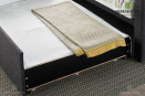 Выдвижная кровать с мягкими бортами выполнена из ДСП с мягкими элементами