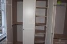 Компактный шкаф с распашными дверцами, с корпусом из ДСП и фасадом из крашенного в белый цвет МДФ