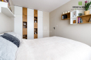 Мебель для спальни: кровать, шкаф, открытые полки и тумбочки выполнены из ДСП Egger